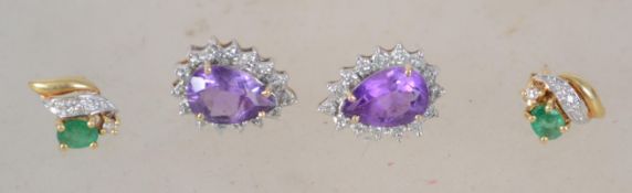 2 pairs of ladies gold earrings to include 1 emerald and diamond adorned set and an amethyst and