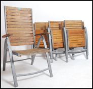 A set of 4 contemporary teak slatted folding garde