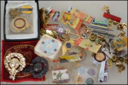 A collection of enamel badges dating to the 20th c