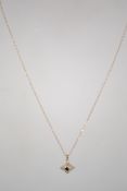 A ladies vintage 9ct gold pendant and necklace chain. Central stone with diamond surrounds. Total