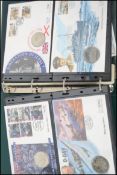 An album full of commemorative coin covers to include 50th anniversary of the liberation of