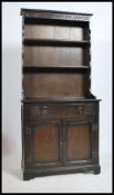 A 20th century Jacobean revival oak welsh dresser. Raised on bracket feet with cupboards and drawers