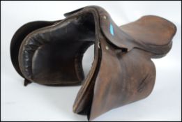 A vintage 20th century leather horses saddle by saddle makers Hayes of Cirencester
