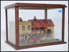 An unusual 20th century glass cased model of a pub