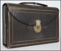 A 19th century leather tooled cased travelling wri