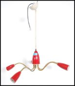 A stunning atomic five point ceiling light fixture