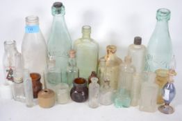 A collection of bottles, ink pots etc. Dating from the late 19th century