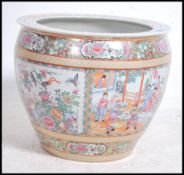 A large Chinese famille rose ceramic carp bowl. He