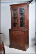 A Victorian mahogany library bookcase cabinet rais