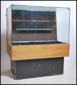 A retro 1970's shop display counted cabinet having
