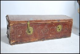 A Georgian style, leather covered, domed trunk, th