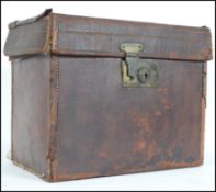A vintage early 20th century leather strong case having hinged top revealing a spacious interior.
