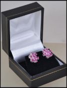 A pair of ladies silver and pink sapphire type sto