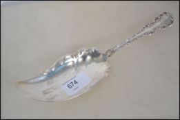 A large Sterling silver fish knife of rococo form