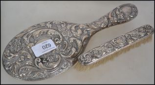A silver hallmarked large ladies vanity mirror wit