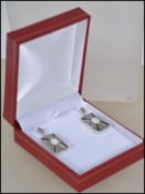 A pair of ladies silver, opal and onyx Art Deco st