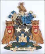 A 20th century large armorial crest / coat of arms
