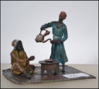 A cold painted bronze in the manner of Bergman. Th