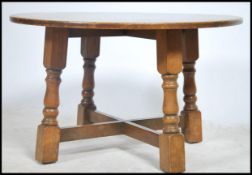 A good 20th century Jacobean oak circular occasion