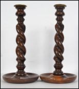 A pair of early 20th century oak barley twist cand
