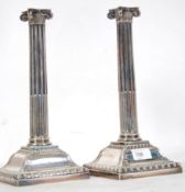 A pair of large silver hallmarked candlesticks by