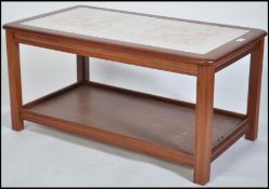 A 1970's teak and twin tile coffee table. The dark