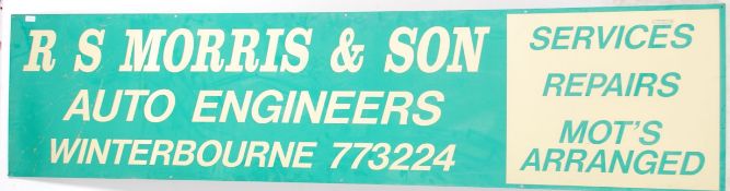 A retro 20th century two tone Garage sign with not