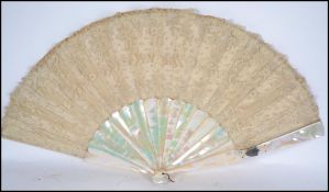 A 19th century folding fan, with mother of pearl g