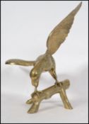 A vintage 20th century large brass eagle figurine