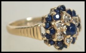 A 9ct gold hallmarked sapphire and diamond cluster