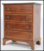 An Edwardian mahogany inlaid bachelors chest of dr