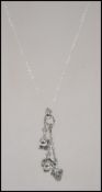 An unusual silver tree scull drop pendant and neck