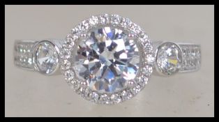 A ladies silver and cz adorned dress ring in the f