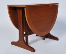 A retro 1970's Parker Knoll small drop leaf teak wood occasional table being raised on splayed