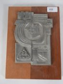 An unusual mid century mounted cast metal plaque for the Slovak ZSNP steel company. The plaque