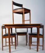 A 1970's McIntosh circular teak wood dining table and chairs in the manner of Frem Rojle. The