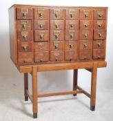 An early to mid  20th century oak Air Ministry Industrial filing cabinet of thirty library index