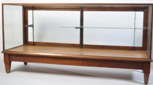 An early 20th century large Industrial Haberdashery shop display cabinet being raised on square