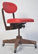 A vintage 20th century industrial swivel machinist chair. Raised on four painted  metal tubular