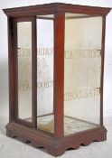 An early 20th  Cadbury's Chocolate shop advertising table top glass display cabinet, The oak frame