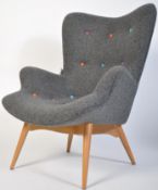 After Finn Juhl, a stunning armchair being raised on tapering turned legs with grey fabric