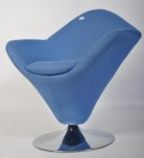 After Verner Panton. A 20th century Verner Panton style cone chair being raised on chrome terraced