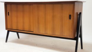 A believed Robin Day for Hille Furniture 1970's teak sideboard. The wide body comprising sliding