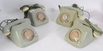 An unusual set of 4 mid century retro two tone ring dial telephones of German origin. Measures