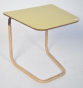 A vintage retro 20th century Staples coffee lounge chair table, having metal adjustable tubular legs