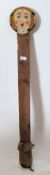 An early 20th century fairground attraction wooden hand painted ' shooting target ' face. The