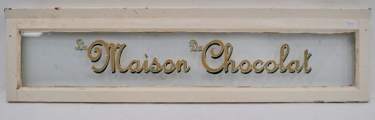 A 1930's - mid century glass window with shop livery graphics for La Maison  Du Chocolat. Original