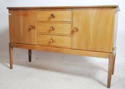 An original Gordon Russell walnut sideboard / dresser. Raised on squared legs with a chest to centre