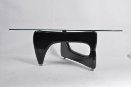 A good contemporary Isamu Noguchi coffee table - occasional table having glass top raised over a