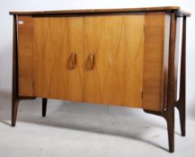A 1950's Heals of London ' Helix ' pattern sideboard raised on external a-frame supports with twin